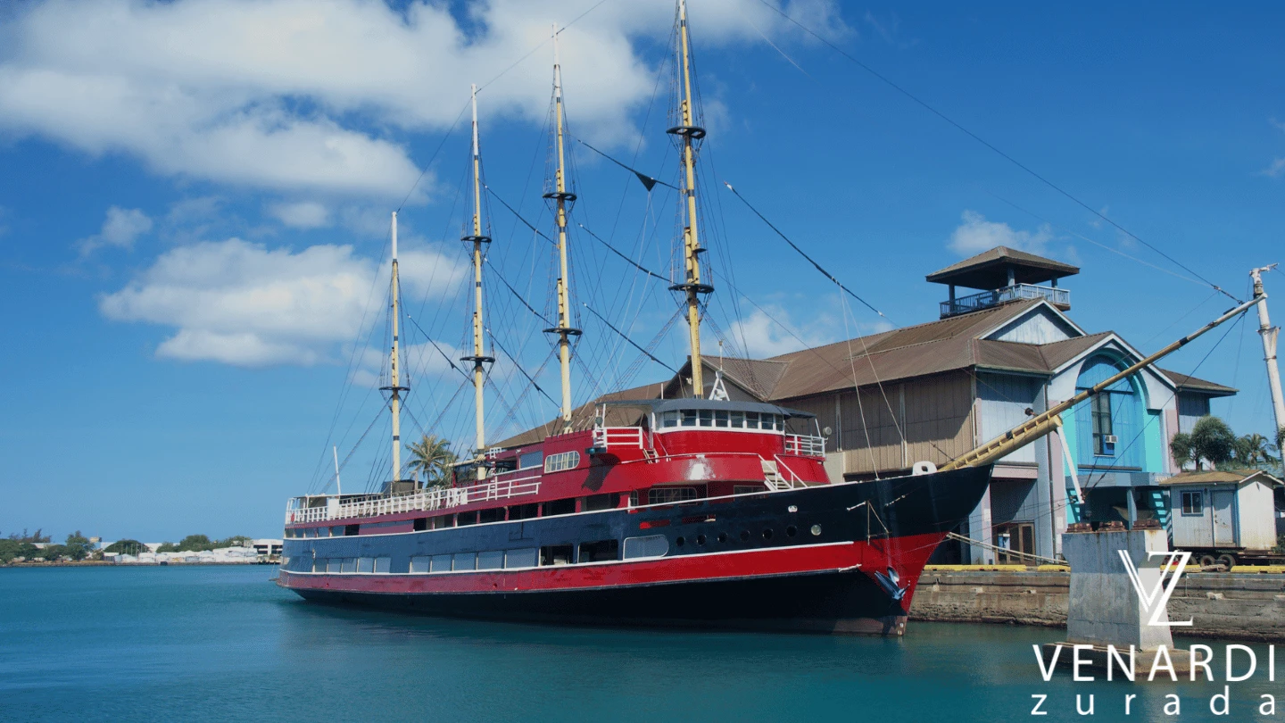 a red maritime ship at the dock